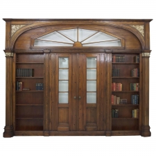 Large Architectural Pass-Through with Bookcases Flanking Two Entry Doors